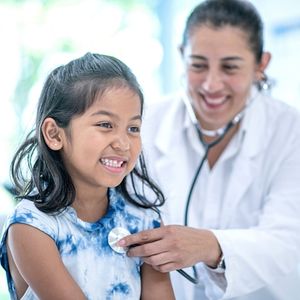 Child receiving a medical exam